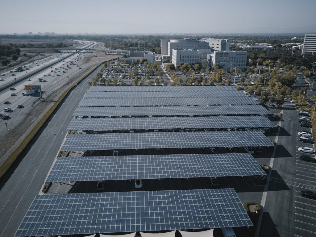 pexels-photo-9799757 Aerial view of extensive solar panels in an urban setting, showcasing renewable energy.