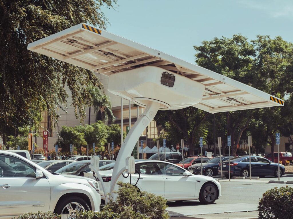 pexels-photo-9800030-9800030 Modern solar-powered charging station for electric vehicles on a sunny day.